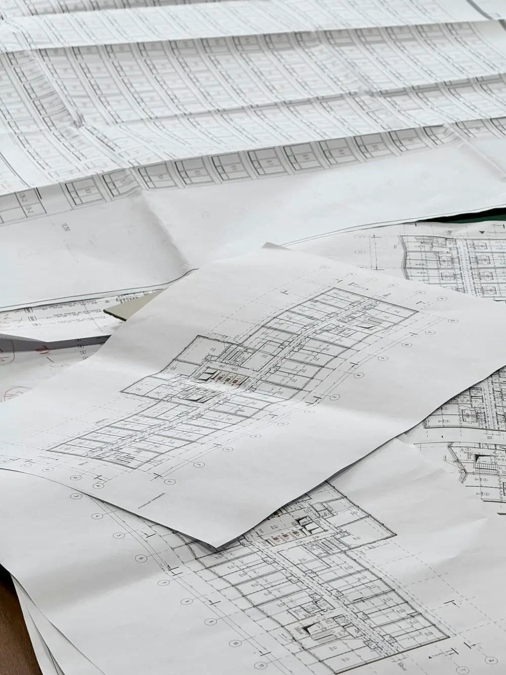 Rolled building plans on a table